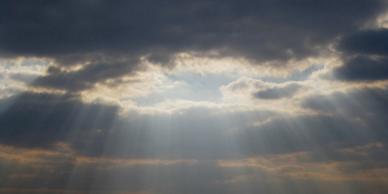 picture of sky full of clouds and sunlight in the evening