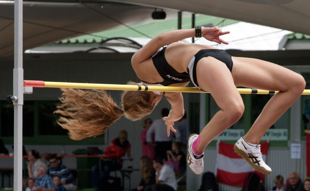 Raising performance: image of a high jumper clearing the bar