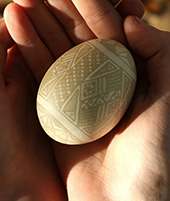 Image for the art of culture change showing cupped hands holding an elaborately decorated egg